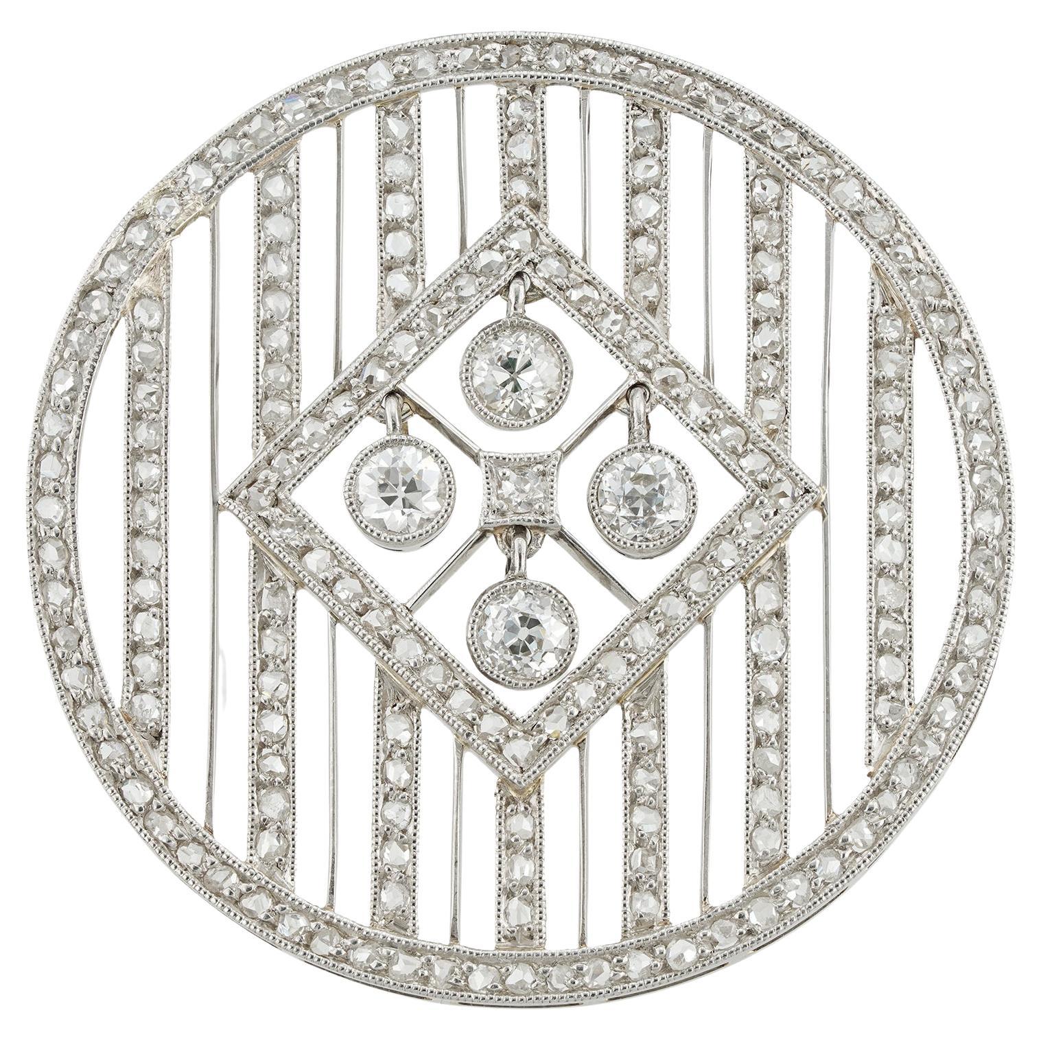 An Edwardian circular diamond brooch-pendant