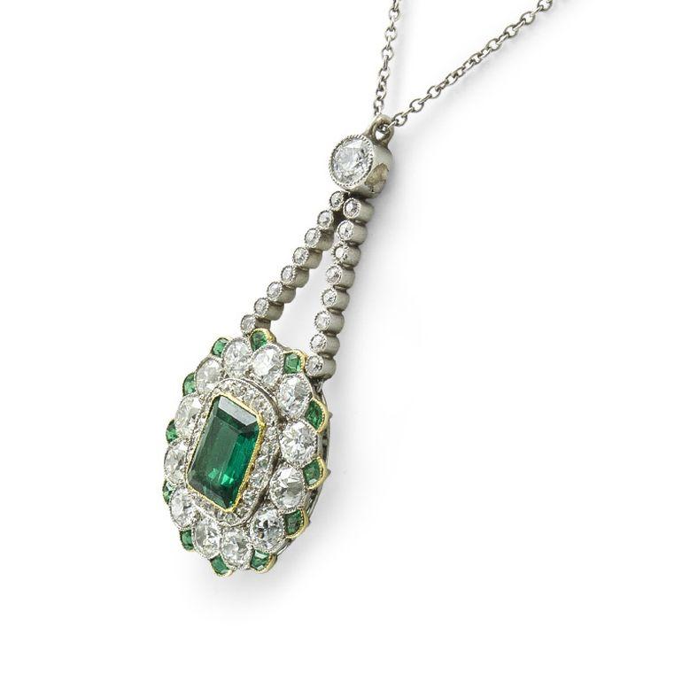 An Edwardian emerald and diamond pendant, to the centre set with an octagonal-cut Colombian emerald accompanied by GCS report number 5776-5717 stating that the emerald to be of Colombian origin weighing approximately 1ct, within millegrain-set
