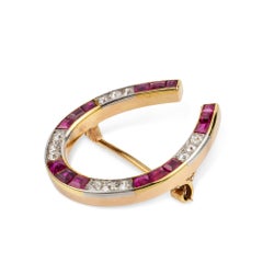 An Edwardian Diamond and Ruby Horseshoe Brooch