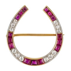 Antique An Edwardian Diamond and Ruby Horseshoe Brooch