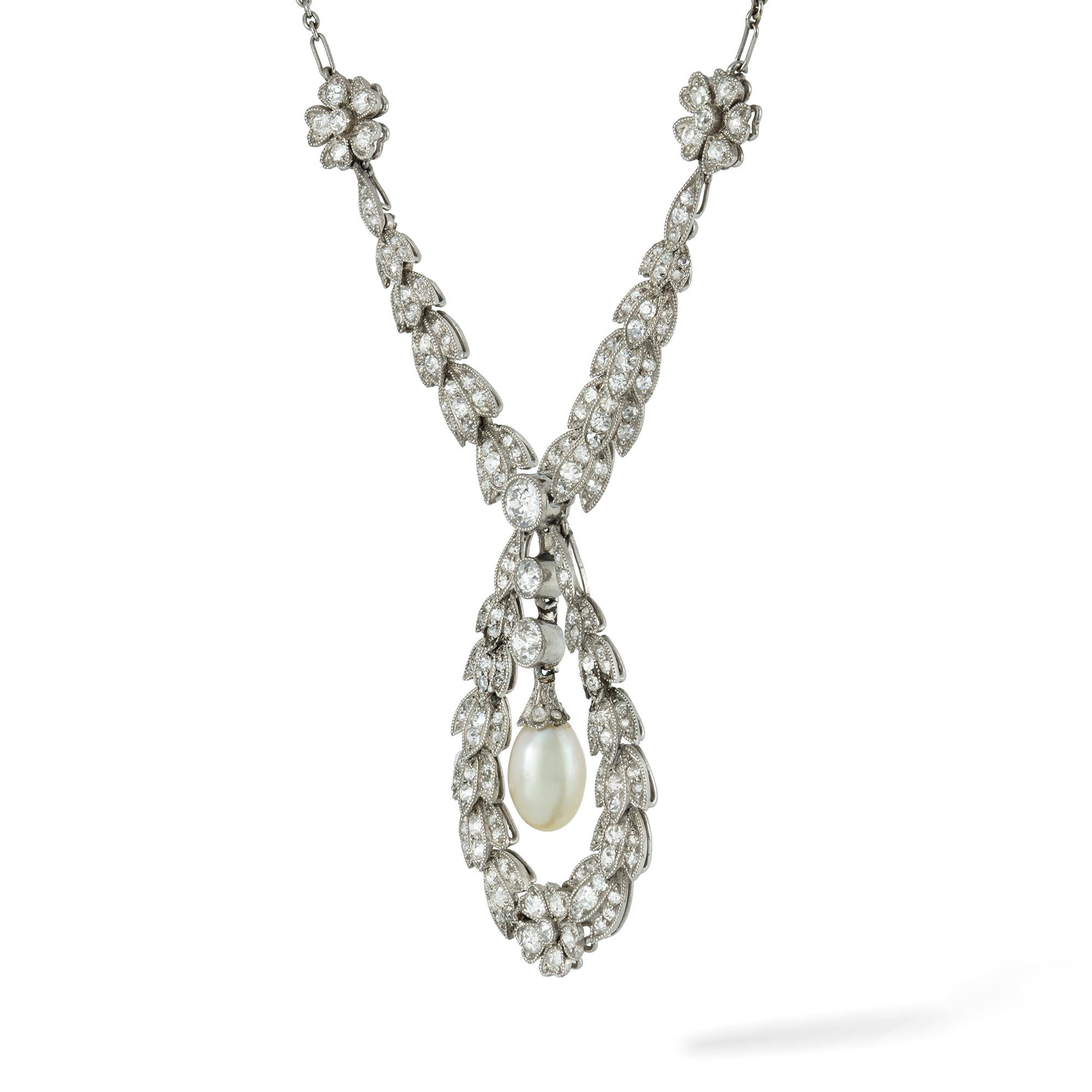 An Edwardian pearl and diamond necklace, the necklace comprising a principle garland drop, suspending an oval pearl measuring aproximately 8.2 x 5.6mm,  to the centre of a diamond-set laurel leaf cluster, the two outer drops suspended from a