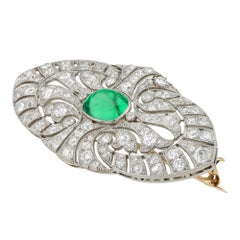 An Edwardian emerald and diamond brooch