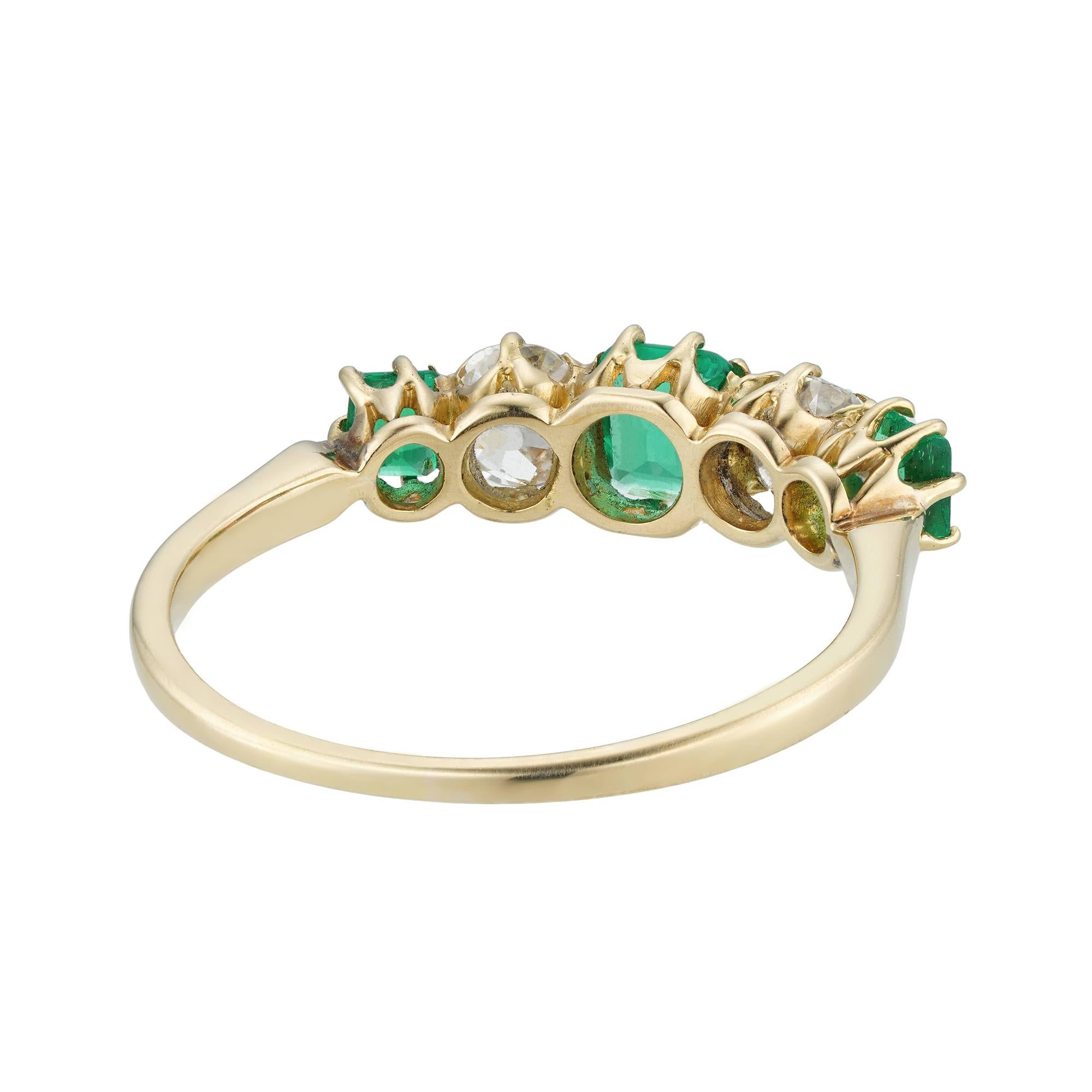 Women's or Men's An Edwardian emerald and diamond five-stone ring For Sale