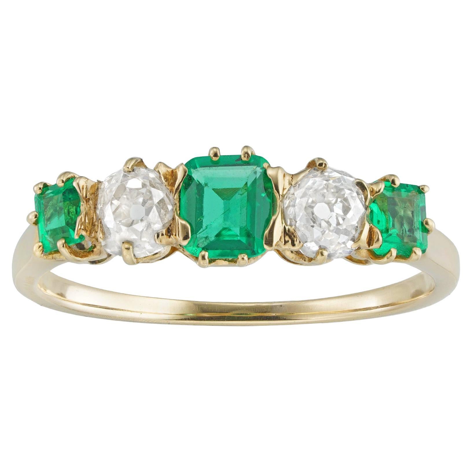 An Edwardian emerald and diamond five-stone ring For Sale