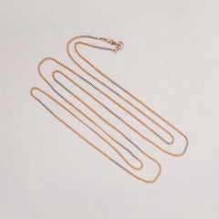 An Edwardian Gold and Platinum Long Chain