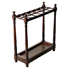 An Edwardian Heals Of London Walnut Stick Stand