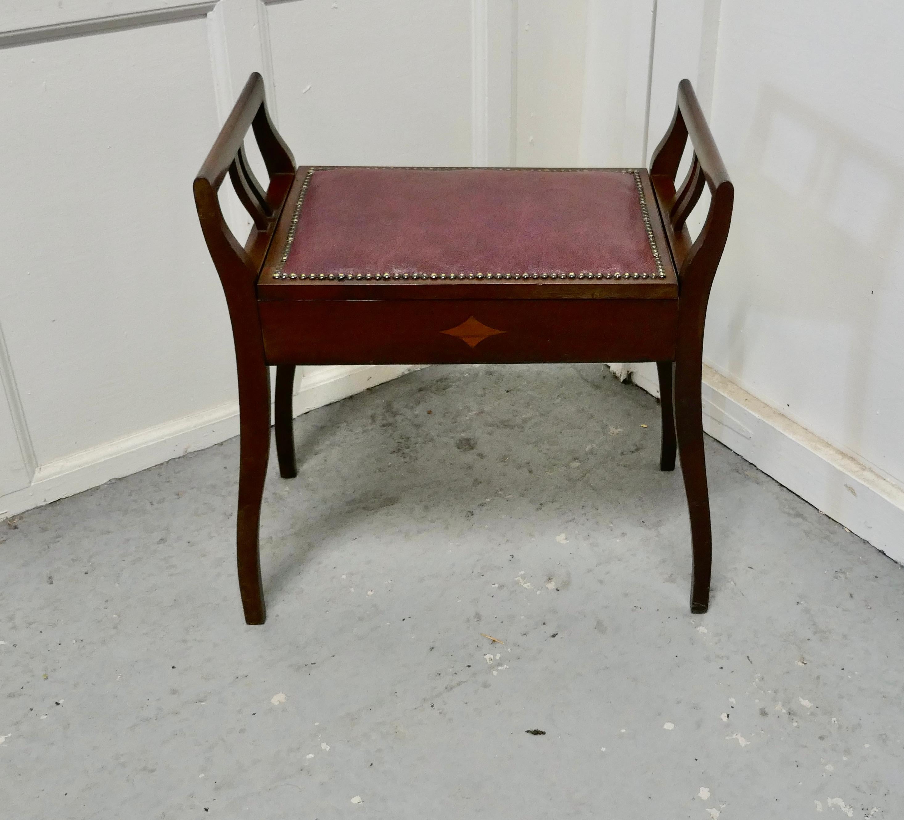 An Edwardian inlaid mahogany piano stool.


This elegant inlaid mahogany piano stool is in very good condition, it has an inlaid decoration, the seat is covered with dark red leather and has a studded border 
The seat opens for the storage of