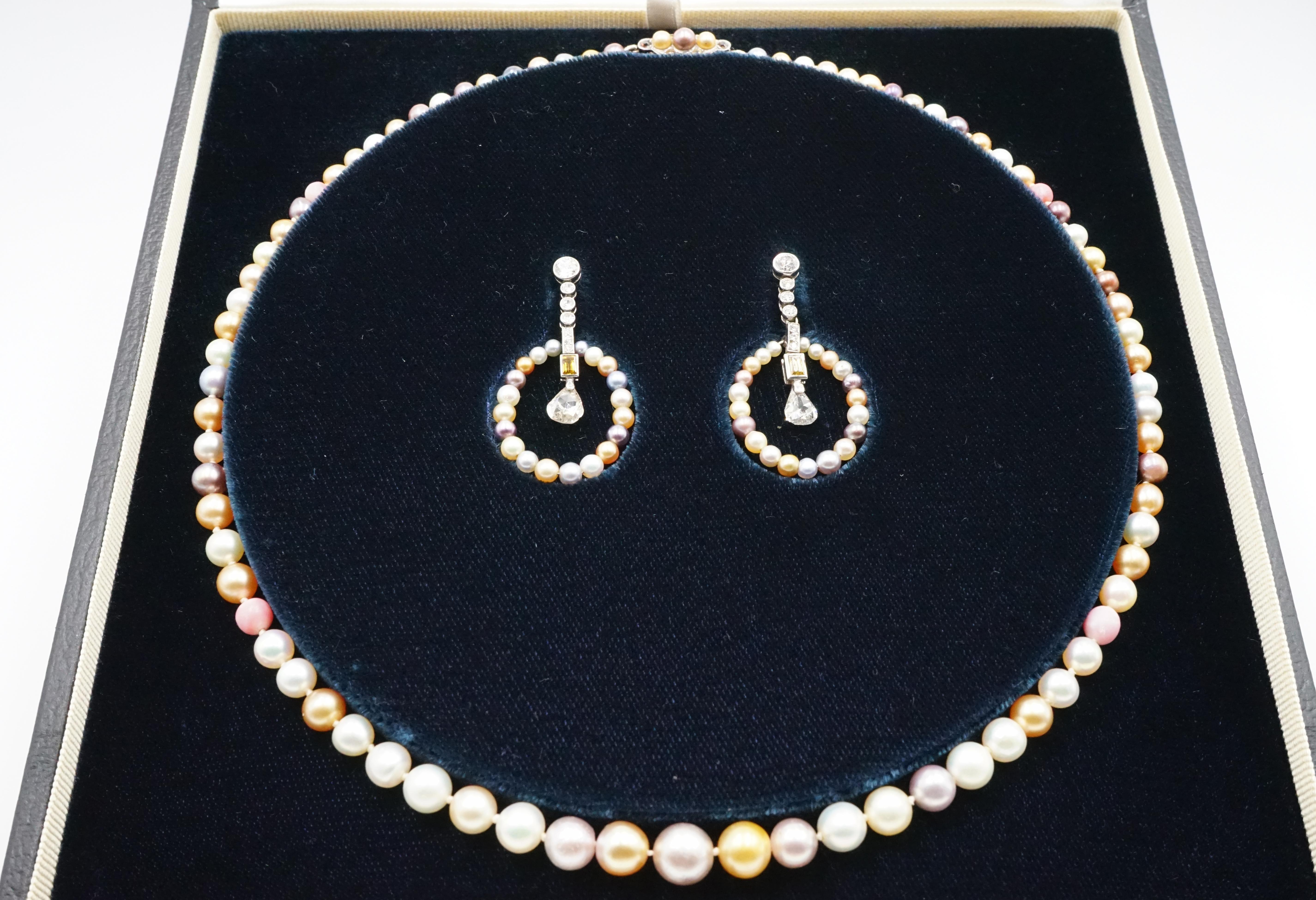 A magnificent Edwardian multicoloured natural pearl, coloured diamond necklace and earring set the quality and the colour of these pearls are truly amazing! Size of these pearls are between 2.4 to 8.4mm.

Necklace: multicoloured natural pearls