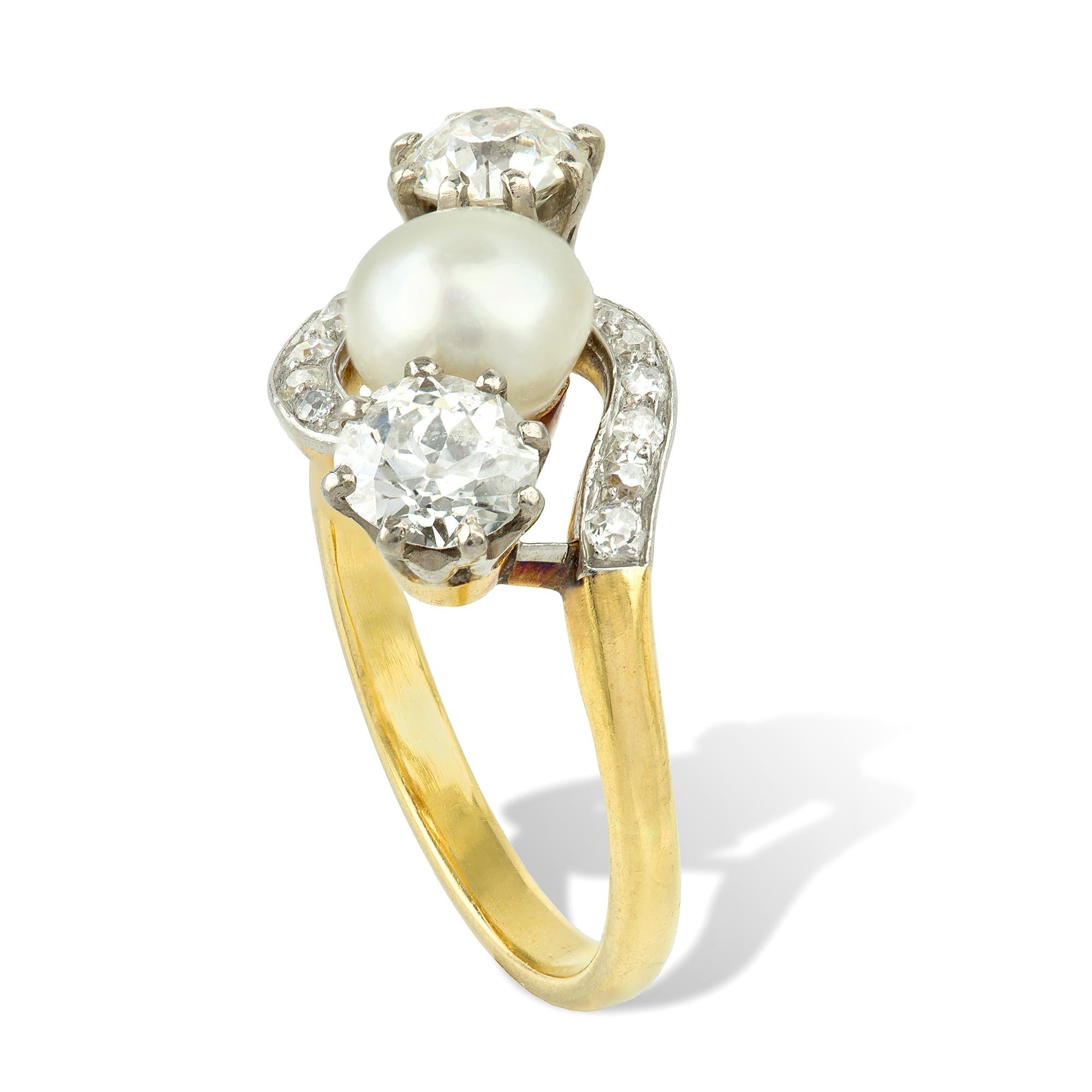 An Edwardian natural pearl and diamond cross over ring, the pearl accompanied by a GCS report stating the pearl to be natural saltwater no treatment, set beside two old brilliant-cut diamonds total estimated weight 1 carat set in white to a yellow