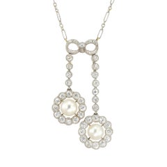 An Edwardian natural pearl and diamond lavalier necklace