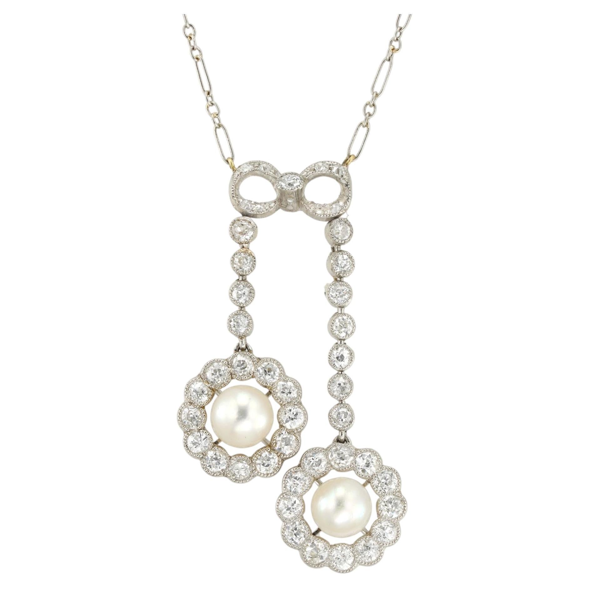An Edwardian natural pearl and diamond lavalier necklace