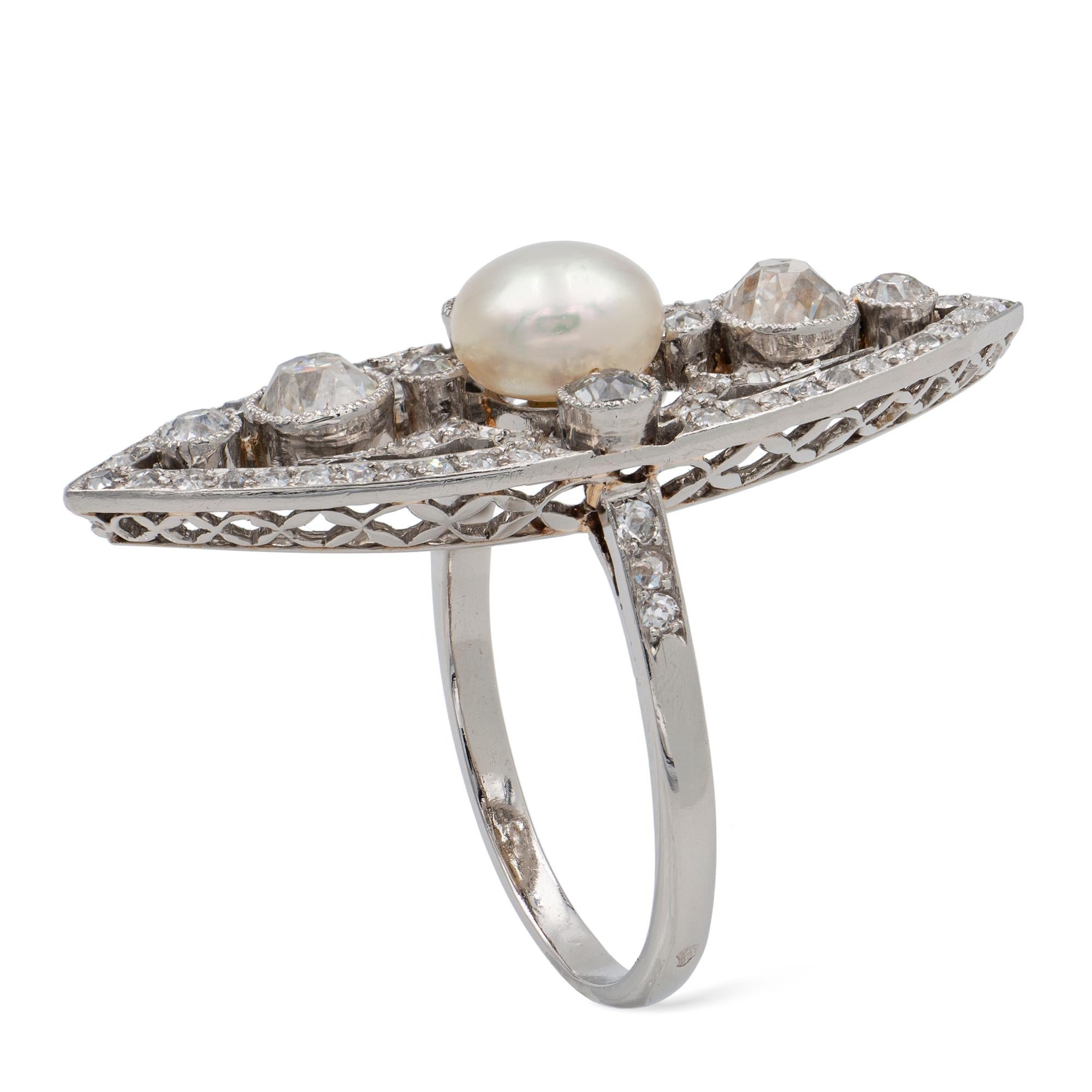 A Belle Epoque natural pearl and diamond navette-shaped ring, the pearl measuring 6.9-7.0 x 4.8mm accompanied by GCS Report stating to be natural of saltwater origin, centrally-set to an openwork old-cut diamond-set plaque, to pierced gallery and