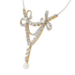 An Edwardian natural pearl and diamond necklace