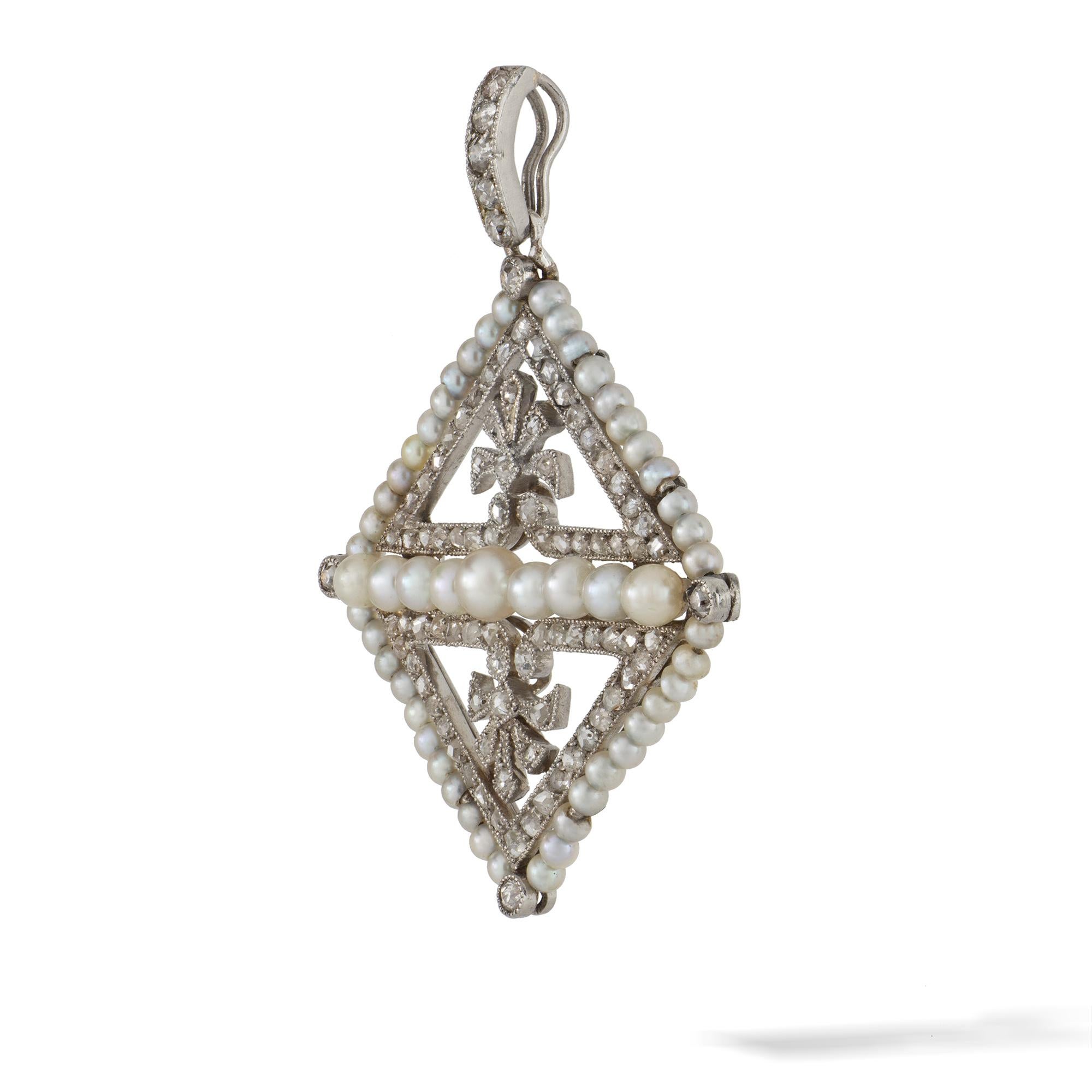 An Edwardian pearl and diamond kite-shaped pendant, centrally with nine pearls forming a line, between two rose-cut diamond-set triangles each centered with a diamond-set acanthus motif, all surrounded by a pearl and diamond cluster and suspended by
