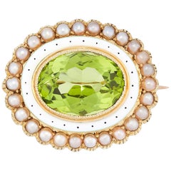 An Edwardian peridot, pearl and enamel brooch