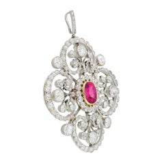 An Edwardian ruby and diamond cluster brooch/pendant