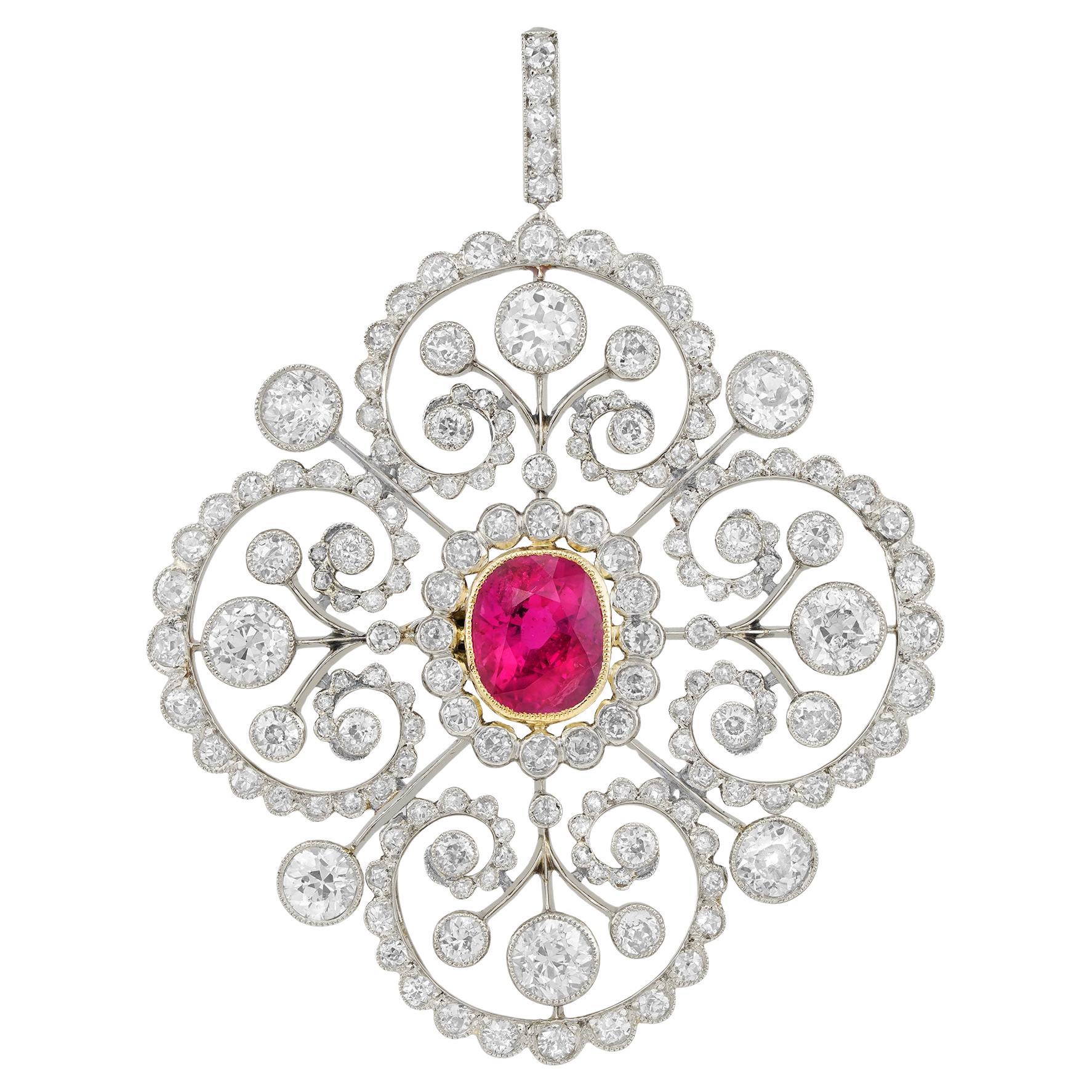 An Edwardian ruby and diamond cluster brooch/pendant