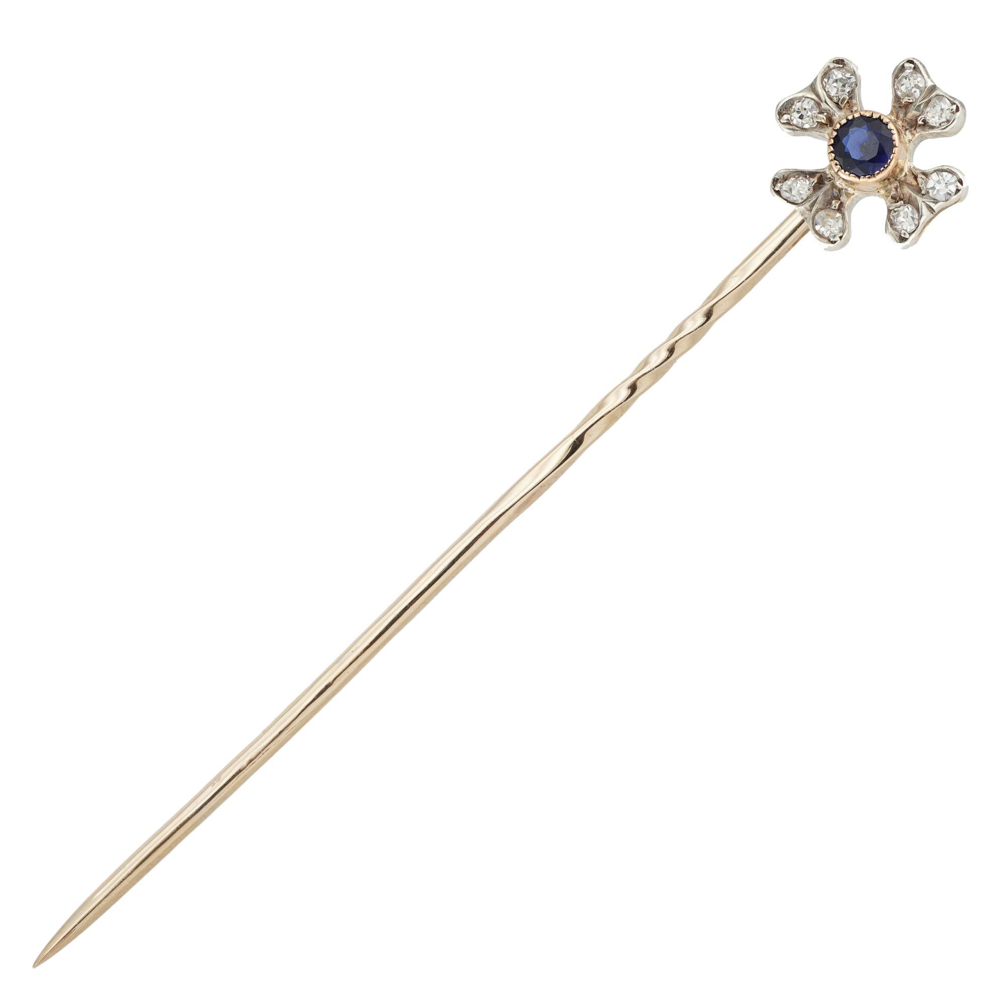 An Edwardian sapphire and diamond four leaf clover pin, to the centre a round faceted sapphire estimated to weigh 0.1 carats millegrain-set in yellow gold collet and surrounded by four leaves, each leaf embellished with two smallold-cut diamonds
