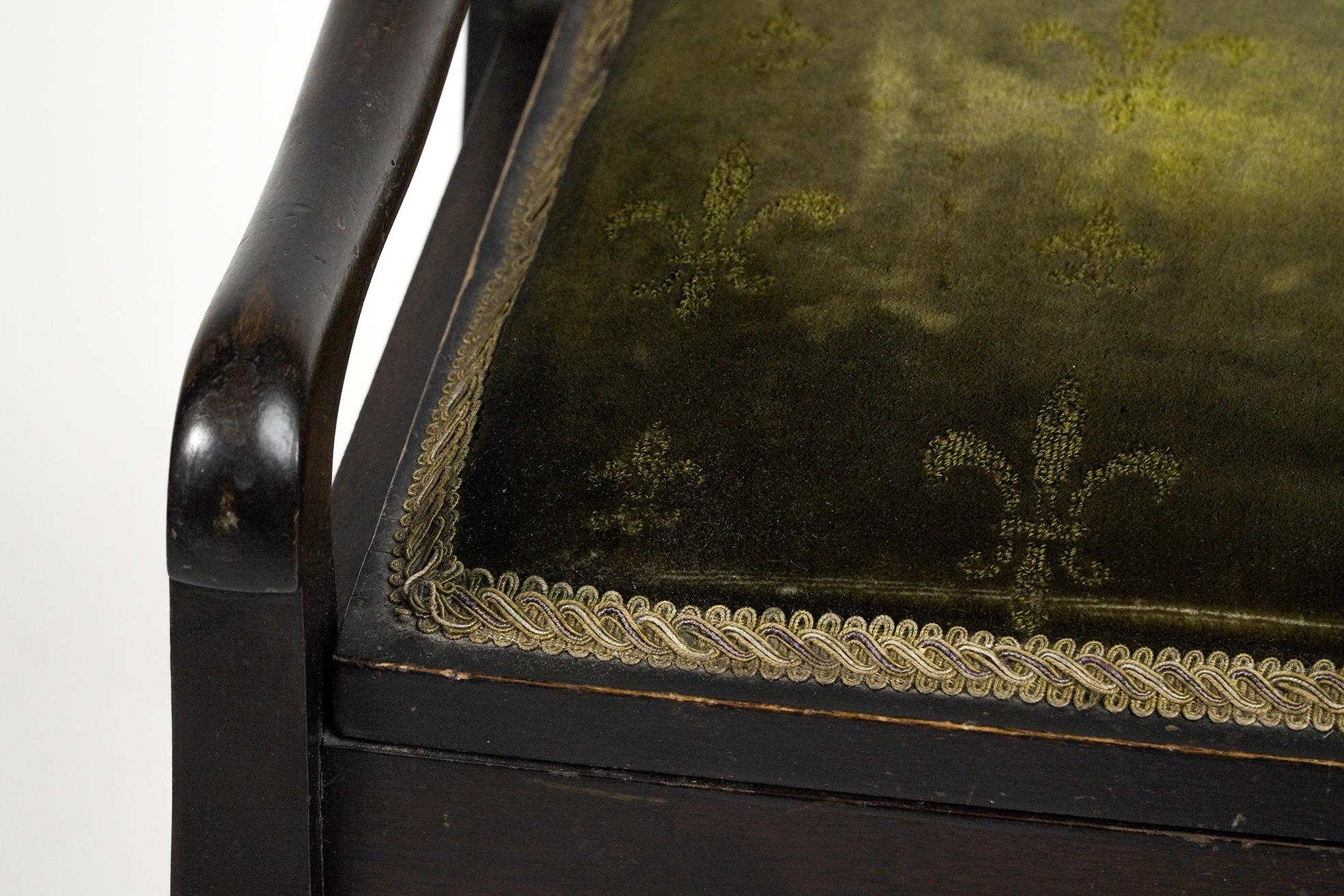 An Edwardian stained Beech piano stool with period green fleur de lys fabric. 6