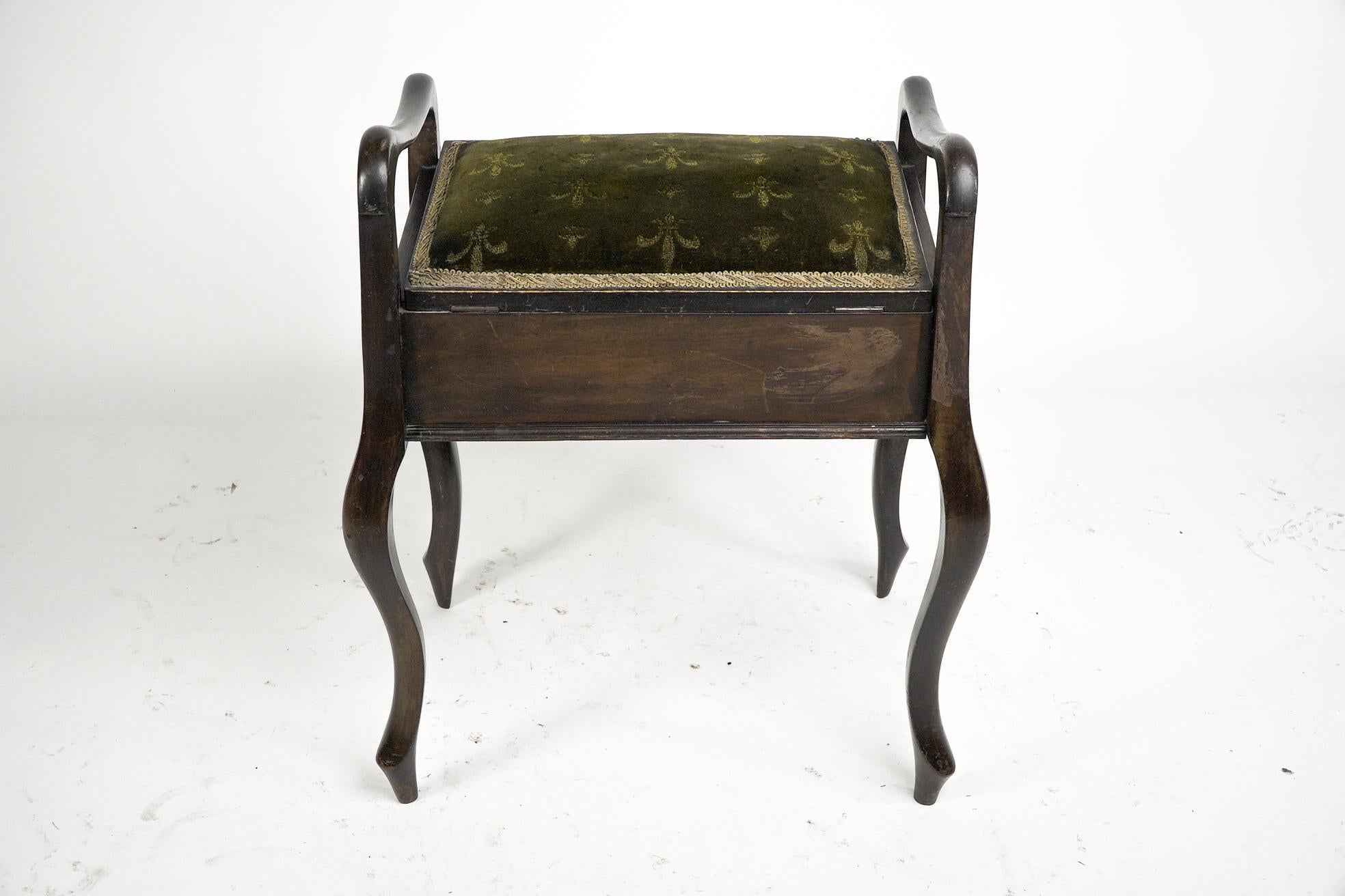 Early 20th Century An Edwardian stained Beech piano stool with period green fleur de lys fabric.