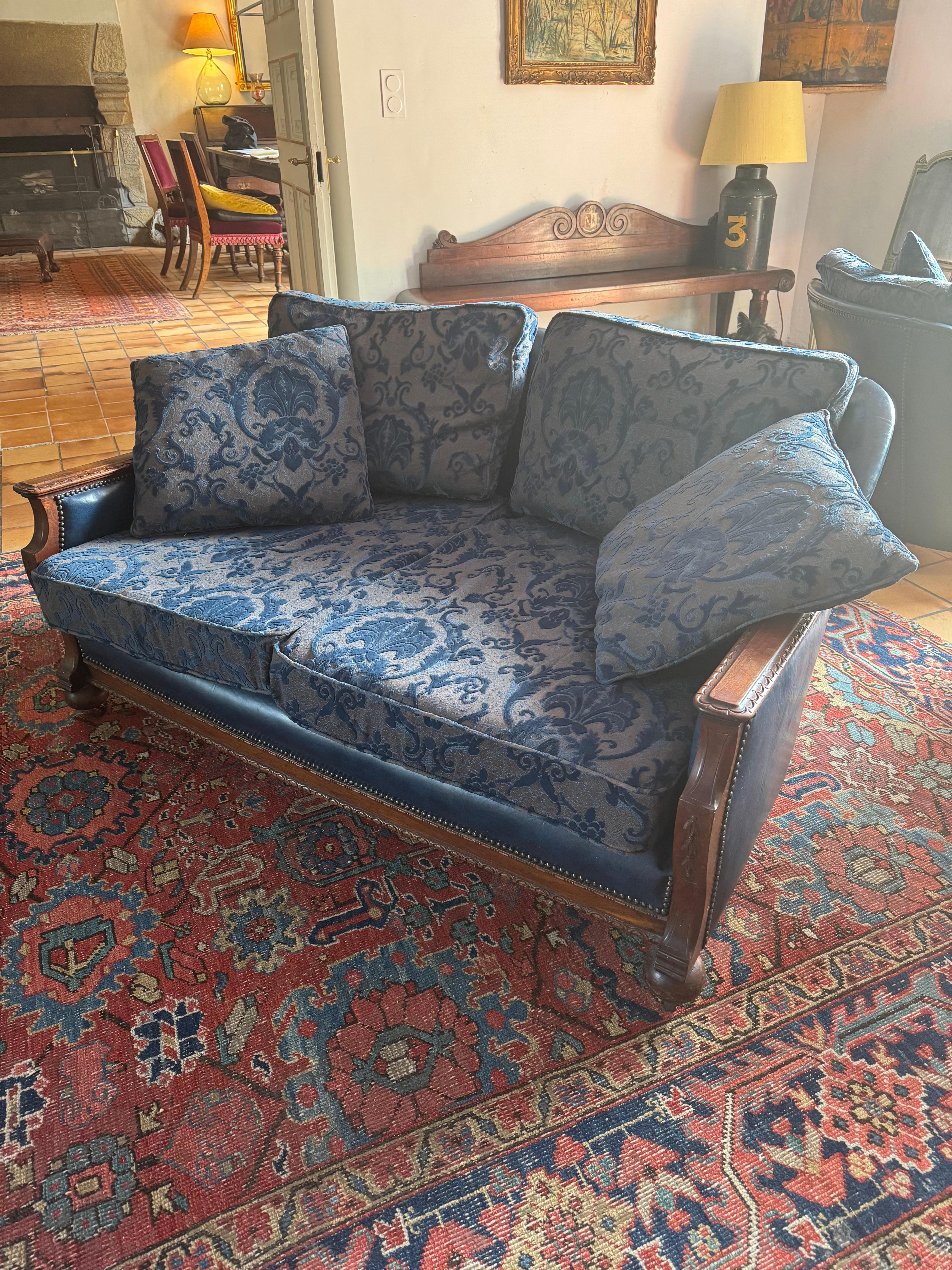 A very elegant faux leather and cotton velvet damask three piece suite, comprising of a pair of armchairs and two seater sofa. Sold as a set. Minor scratches and wear to the faux leather but no tears. Has been reupholstered within the last few years