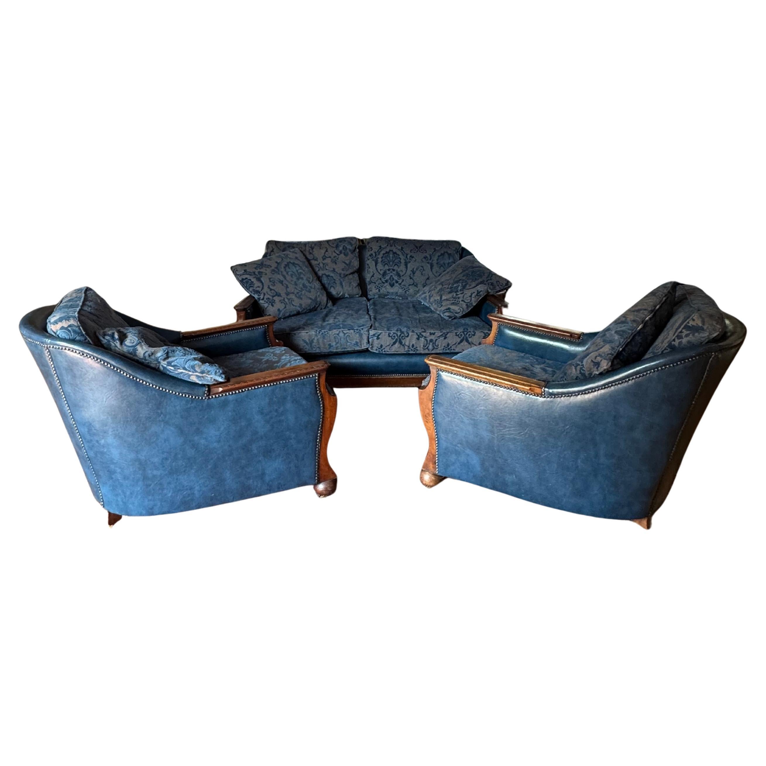 An Edwardian three piece suite including pair of chairs and sofa