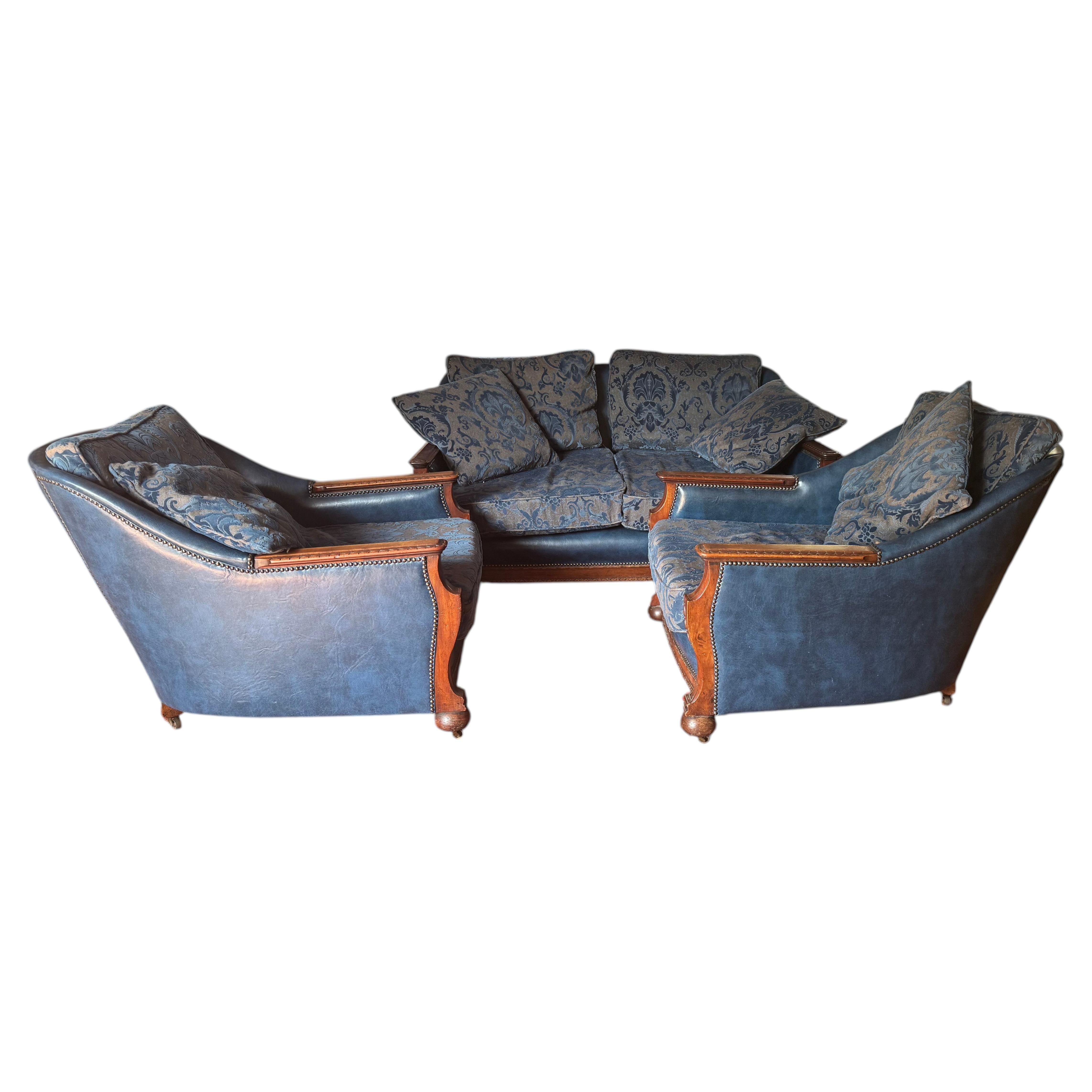 An Edwardian three piece suite including pair of chairs and sofa For Sale