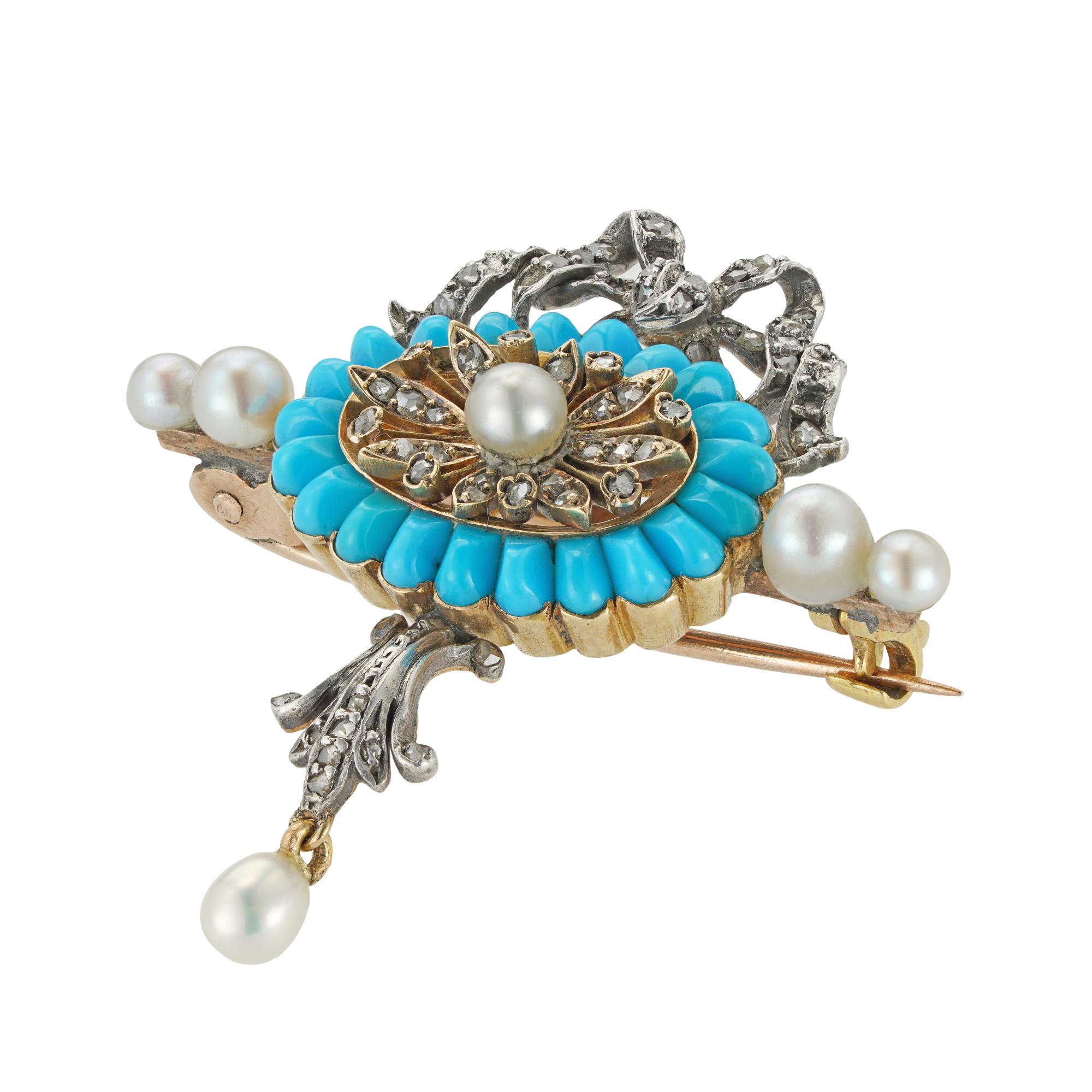 An Edwardian turquoise, pearl and diamond brooch, to the centre with an oval diamond-set flower set with a pearl, surrounded by twenty one cabochon turquoises, suspending an articulated pearl drop and surmounted by a diamond-set bow, mounted in