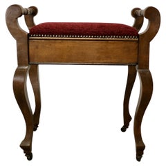 An Edwardian Walnut Piano Stool    