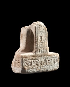 An Egyptian calcite statue fragment inscribed for Queen Nefertari