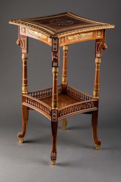 An Egyptian Revival Simulated  Bone Inlaid Parcel Gilt Mahogany Side Table