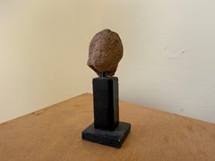 An Egyptian terracotta head of Harpokrates, Ptolemaic