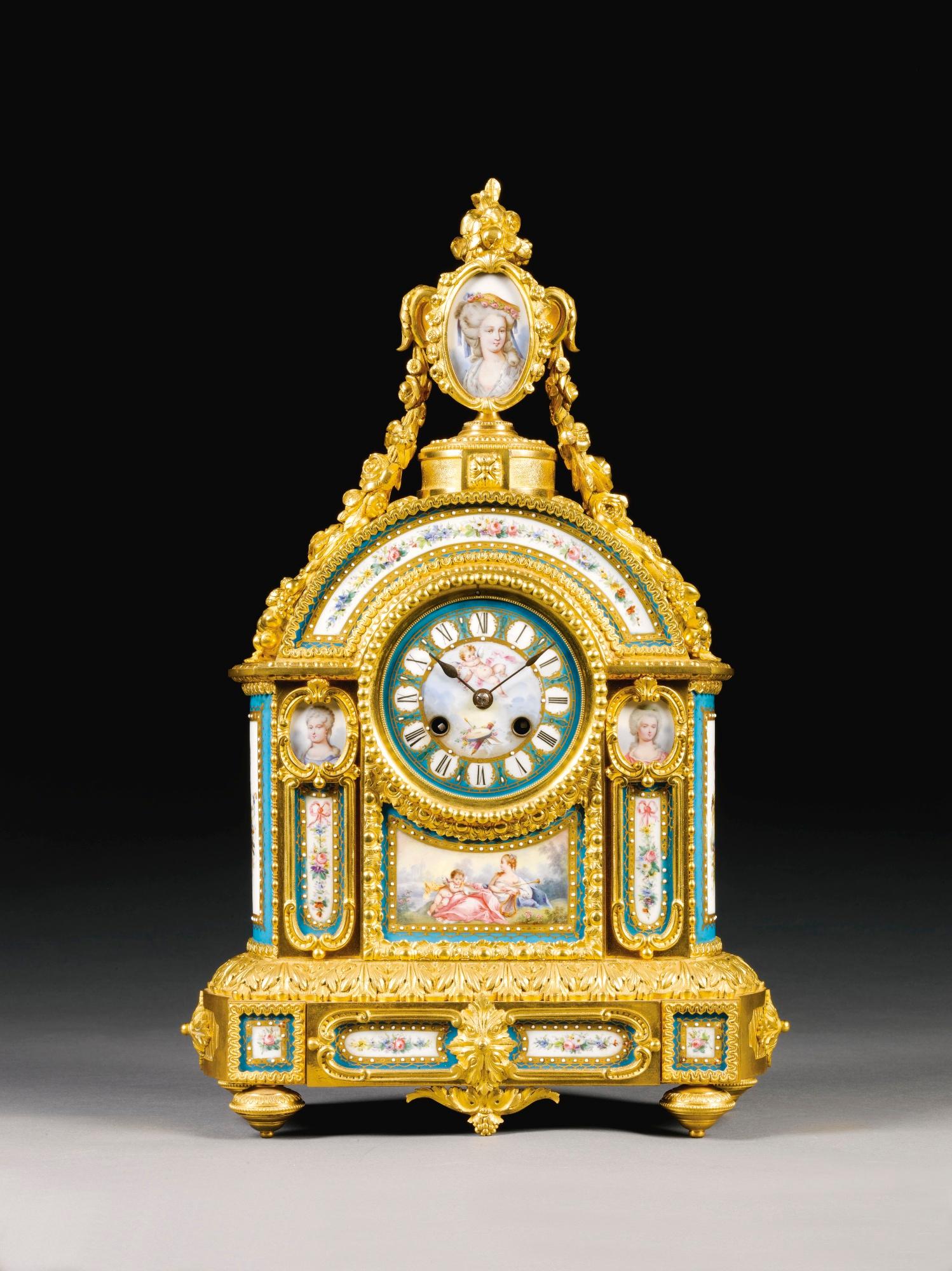 A fine and elaborate gilt bronze and Sèvres-style porcelain mantel clock.

French, circa 1870.

A fine and elaborate gilt bronze and Sèvres-style porcelain mantel clock with a four inch porcelain dial painted at the centre with a putto, and