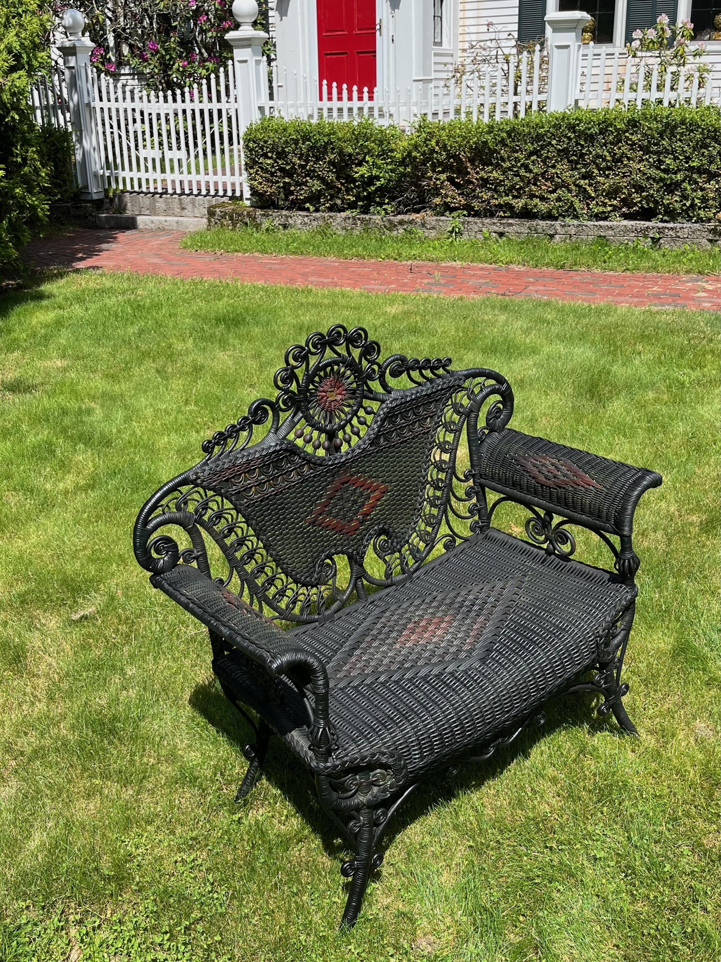 A beautiful and elaborately designed and decorated wicker reception chair, American, C, 1890  in very good condition.
This elaborately decorated seating piece was a multi tasker and was used from the homes entryways for guests, as additional seating