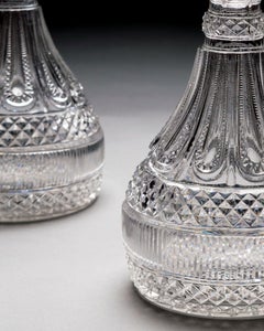 An Elaborately Cut Pair Of Regency Semi Ships Decanters By Perrin & Geddes