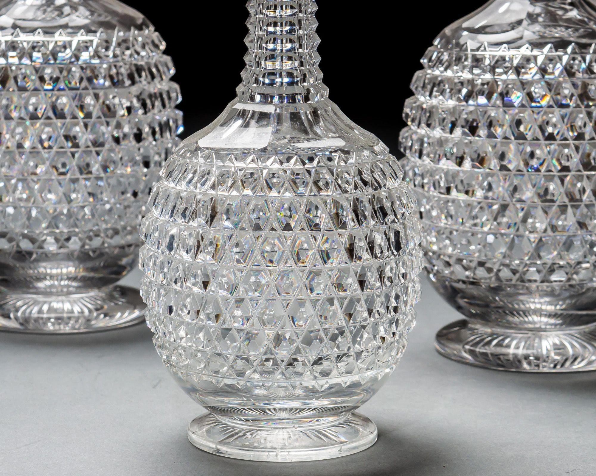 An elaborately cut suite of Victorian decanters consisting of four standard size decanters and two spirit decanters.

SPIRIT DIMENSIONS

Height - 27.5 cm / 11