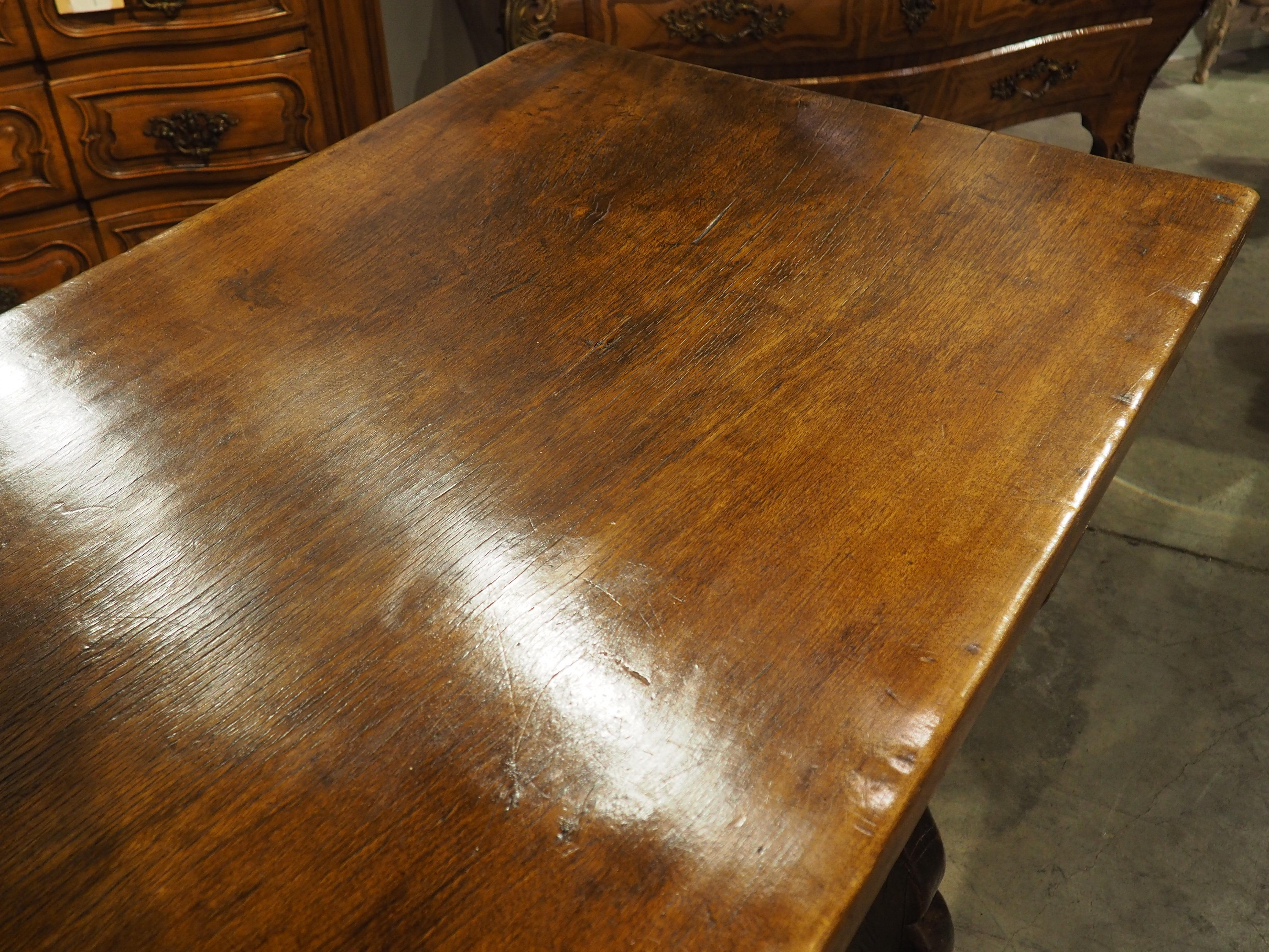 Hand-Carved An Elegant 18th Century Single Walnut Plank Top Dining Table from Spain For Sale