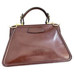 An Elegant 190s Brown Leather and Brass Italian Top Handle Bag