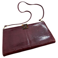 An Elegant 1950s Burgundy Leather and Bakelite Clasp Italian Shoulder Bag