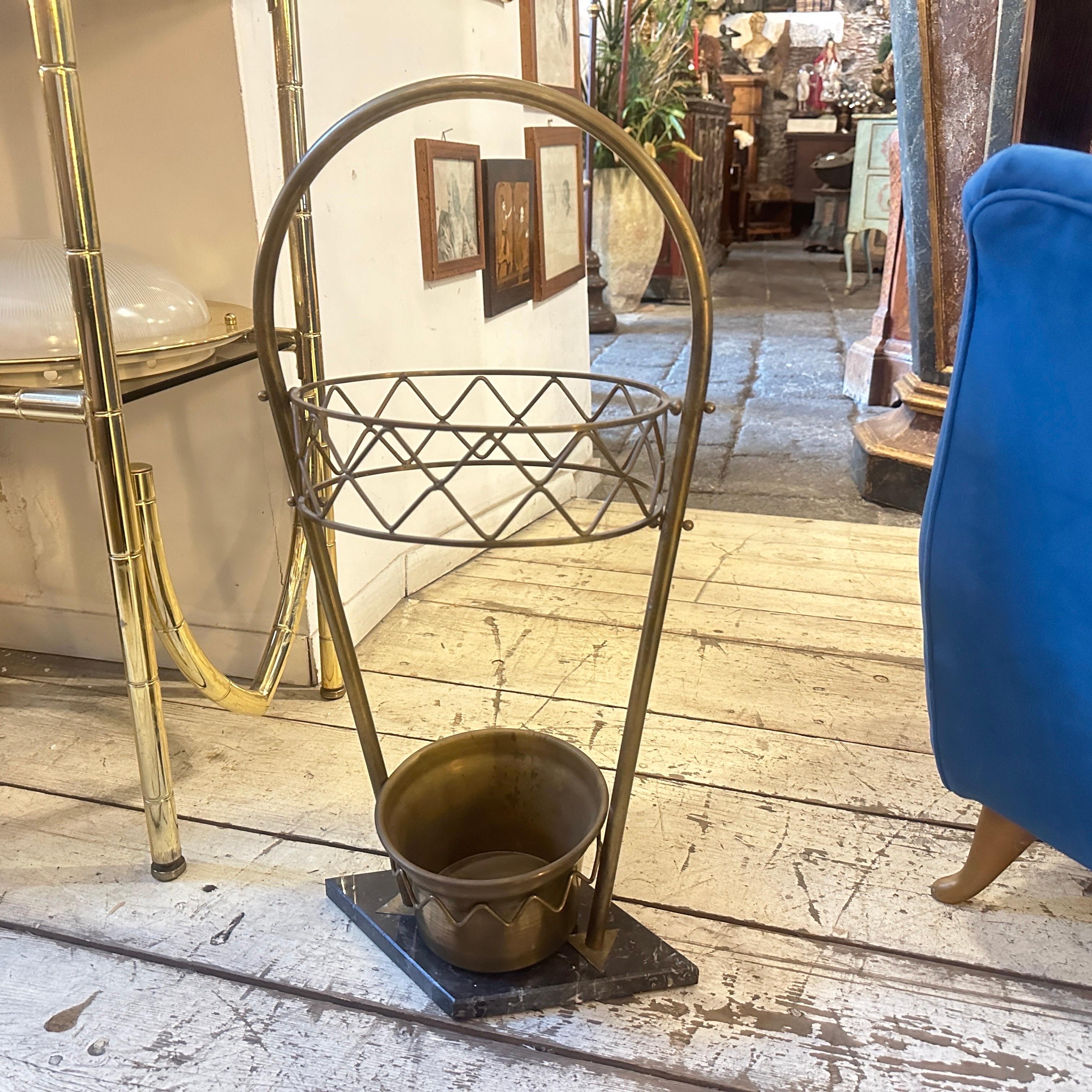 An amazing marble and brass umbrella stand designed and manufactured in Italy in the Fifties in the style of Giò Ponti, brass it's in original patina, black and white marble it's in perfect condition. This umbrella stand reflects the Mid-Century