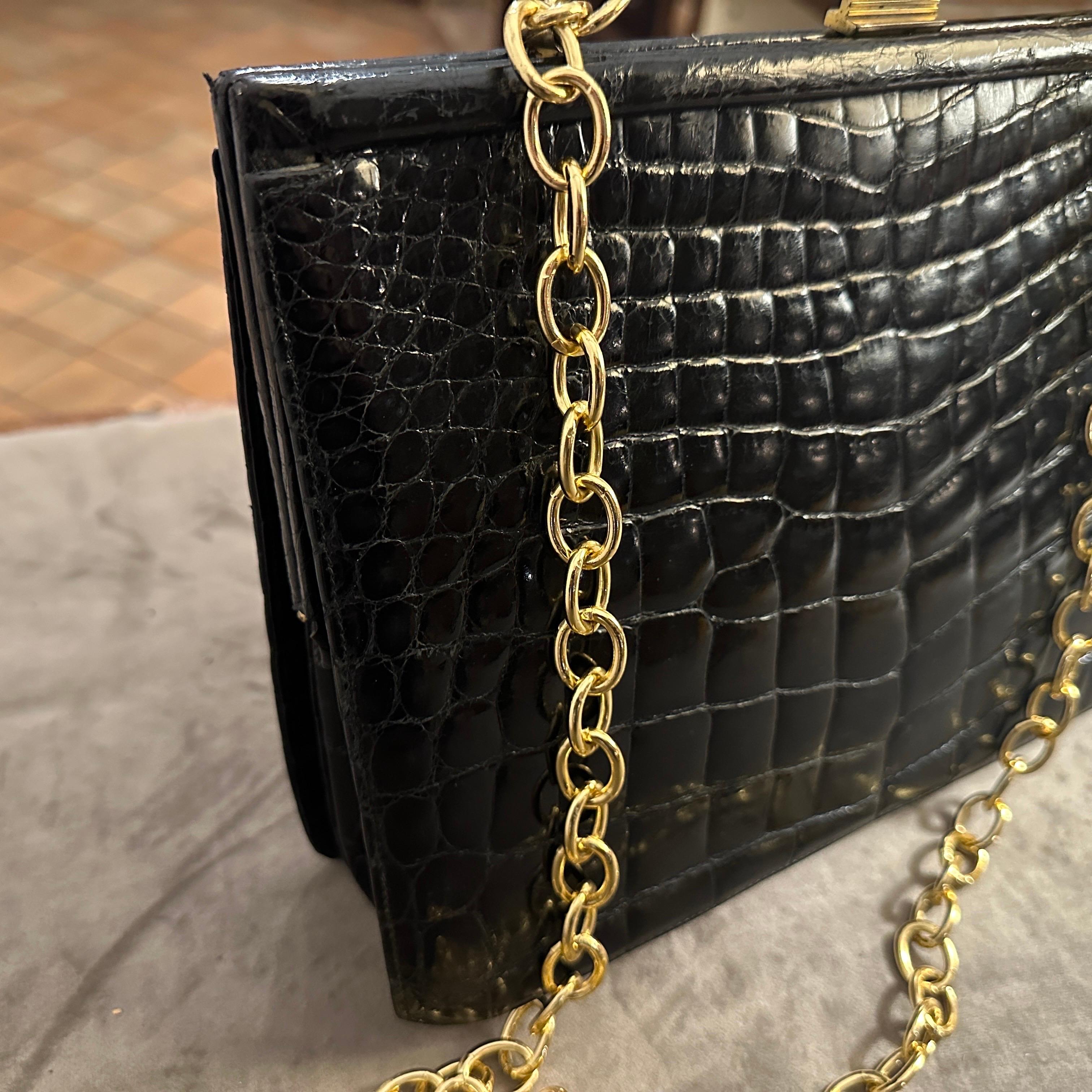 Women's An Elegant 1950s Retro Black Leather and Brass Italian Shoulder Bag For Sale
