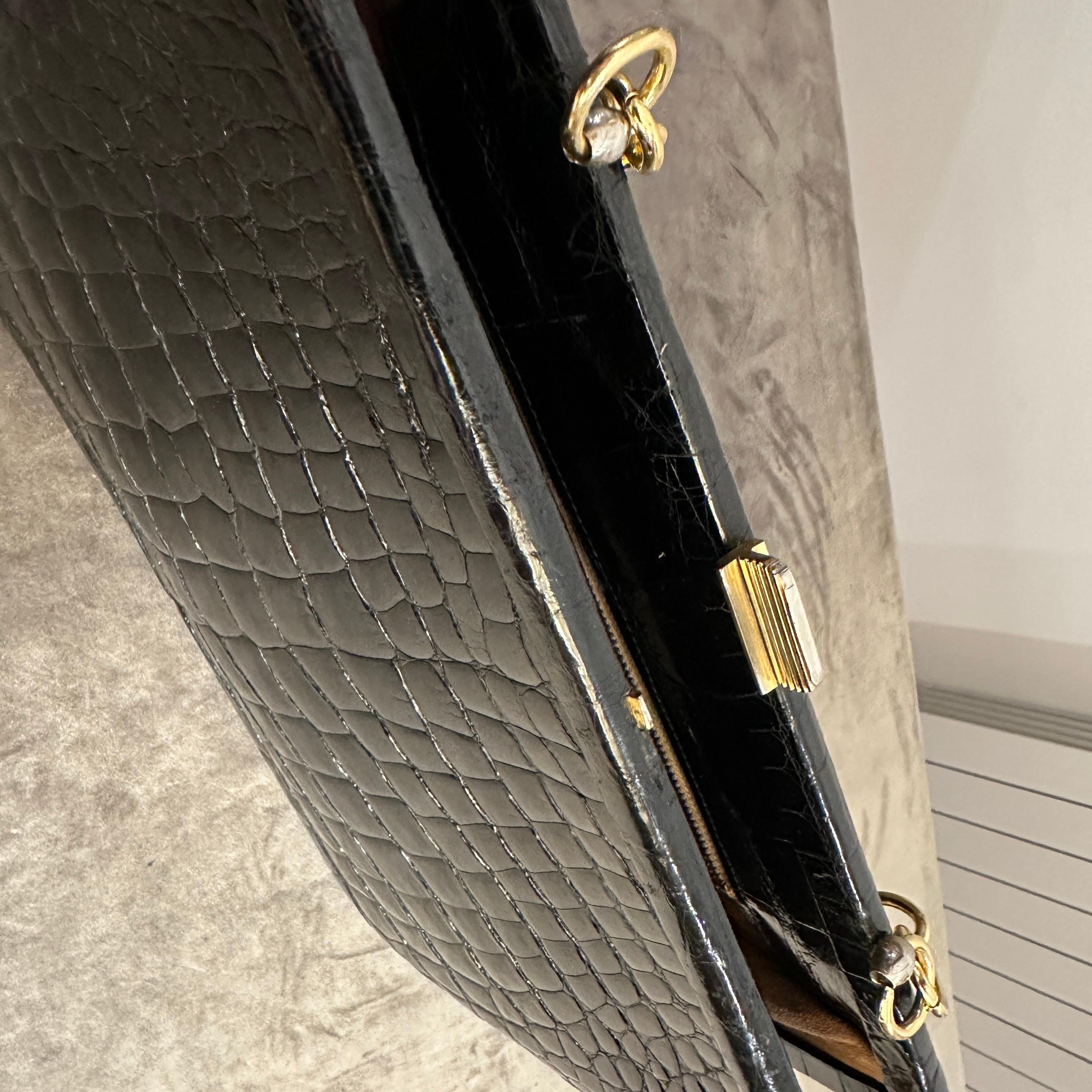 An Elegant 1950s Retro Black Leather and Brass Italian Shoulder Bag For Sale 4
