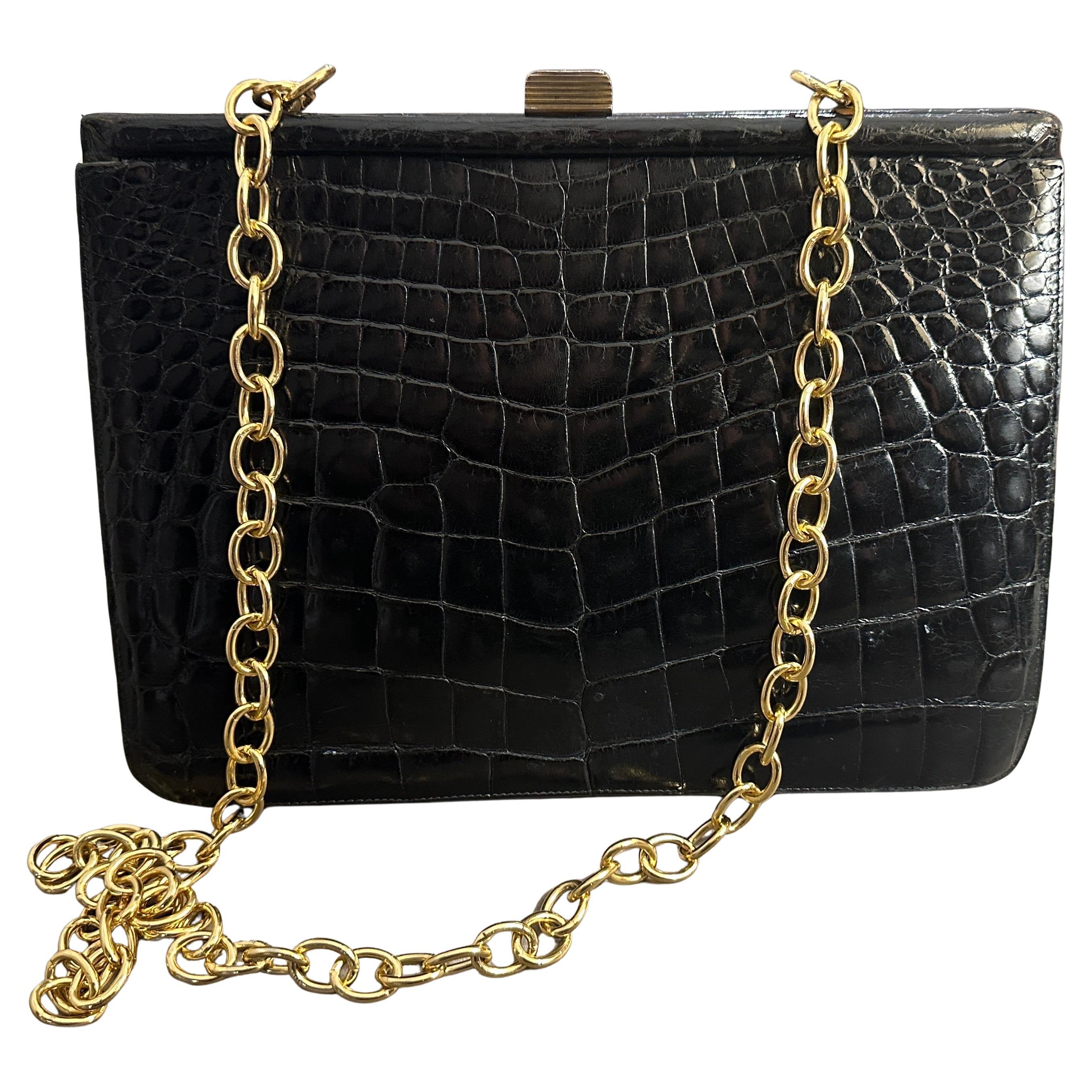 An Elegant 1950s Retro Black Leather and Brass Italian Shoulder Bag For Sale