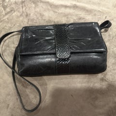An Elegant 1960s Black Leather Shoulder Bag by Gucci