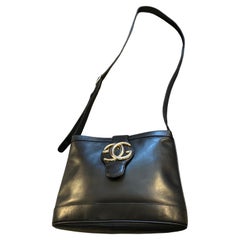 An Elegant 1970s Black Leather and Brass Bucket Shoulder Bag by Gucci