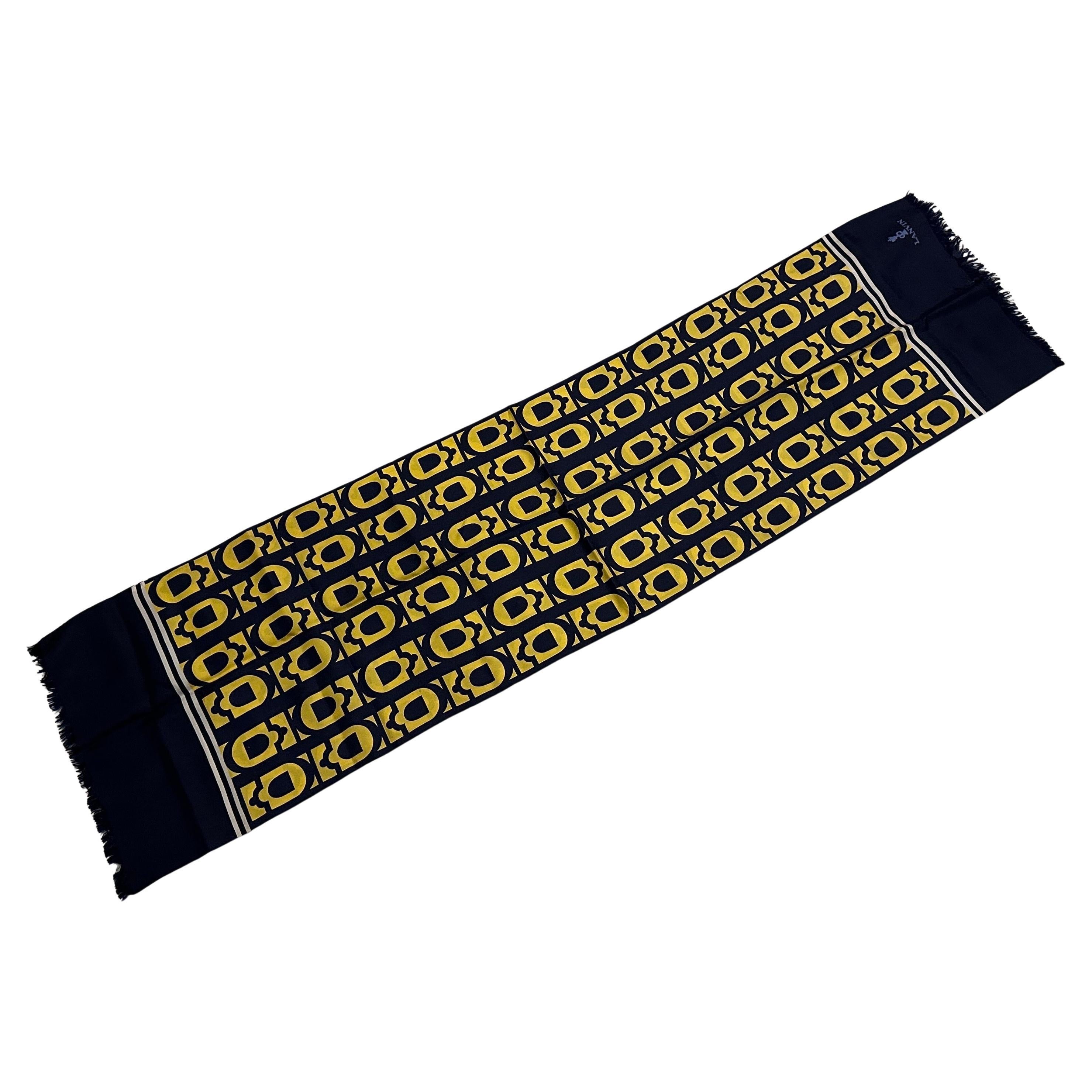An Elegant 1980s Blue and Yellow Silk Scarf by Lanvin Paris
This sophisticated and vibrant 1980s silk scarf by Lanvin Paris is an exquisite accessory captures the elegant aesthetic of the era, offering a touch of timeless French chic.
Crafted from
