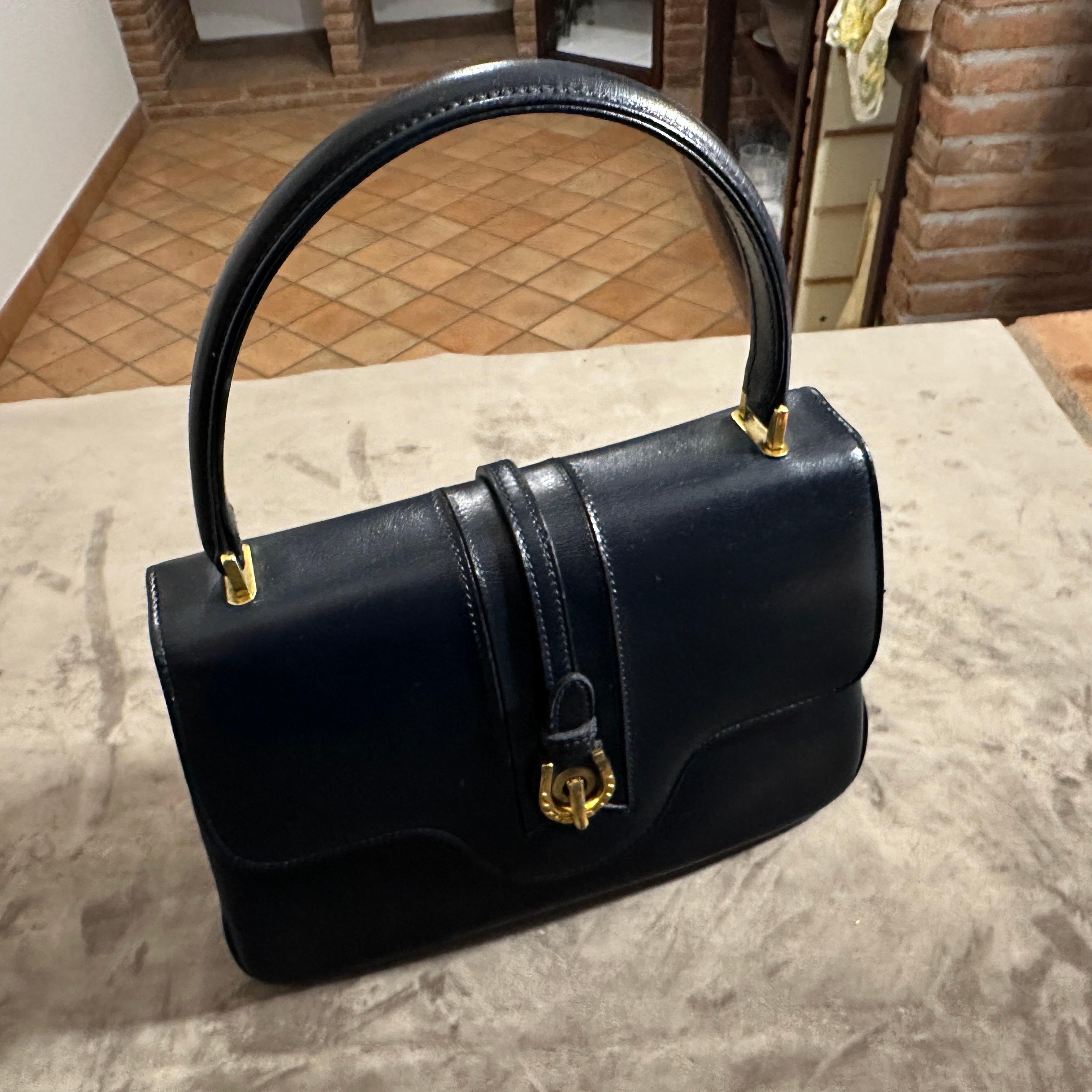 Women's An Elegant 1980s Blue Leather and Brass Hand-Bag by Gucci