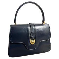 An Elegant 1980s Blue Leather and Brass Hand-Bag by Gucci