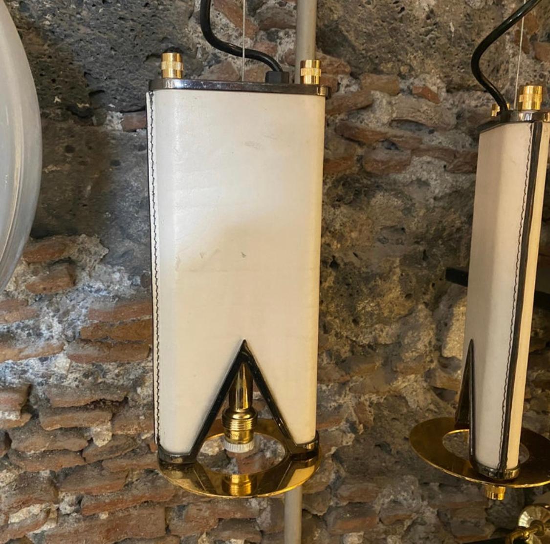 Hand-Crafted An Elegant 1980s Mid-Century Modern Brass and Skin Italian Double Chandelier For Sale