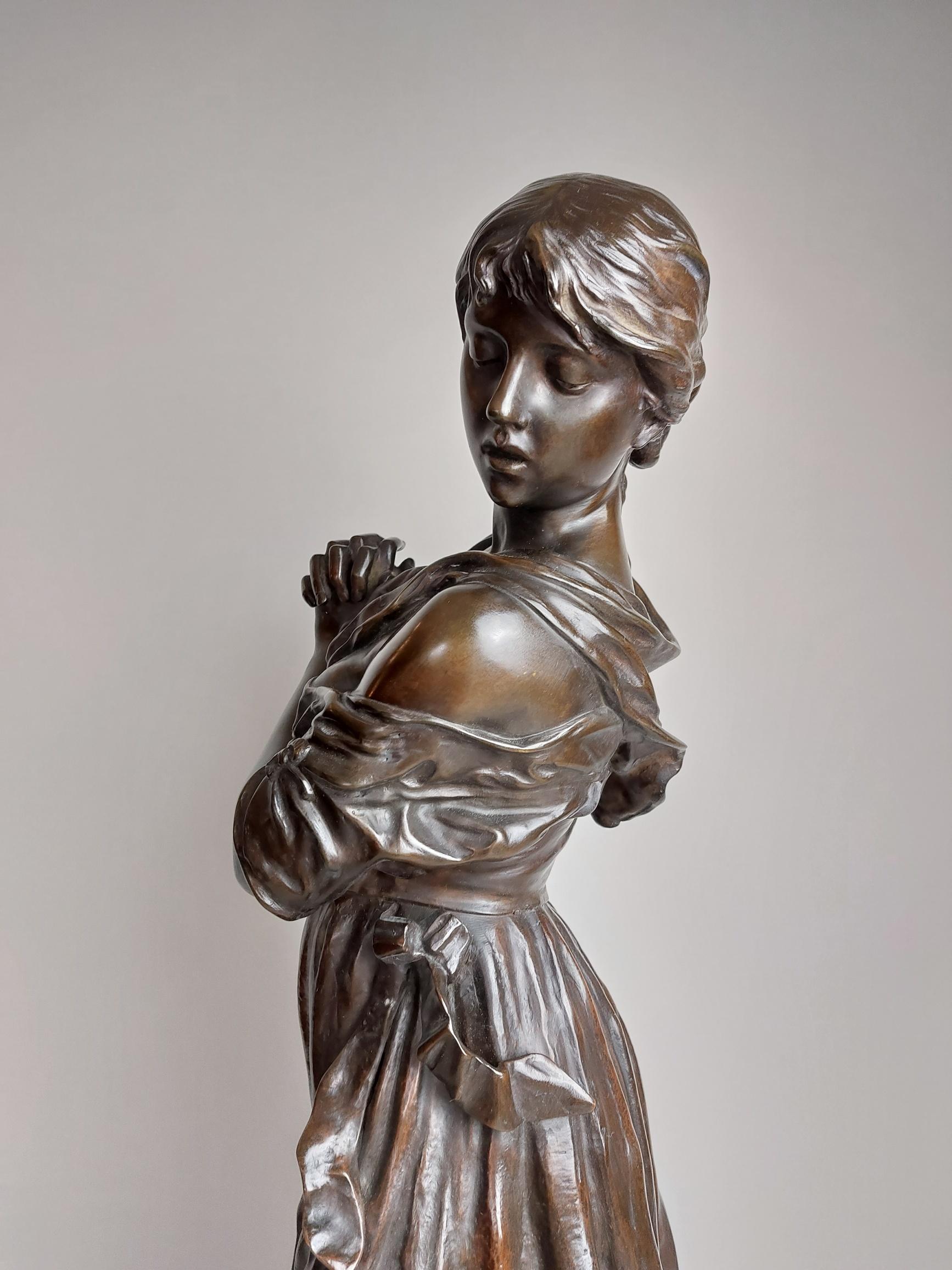 An elegant 19th century bronze of a barefoot peasant girl looking at a pottery jug she has just dropped, the liquid spills out and down the side of the base in an interesting artistic touch.